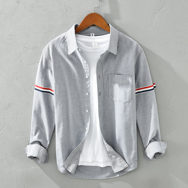 Breathable unisex striped long sleeve shirt. Lightweight casual button-up for stylish everyday comfort.