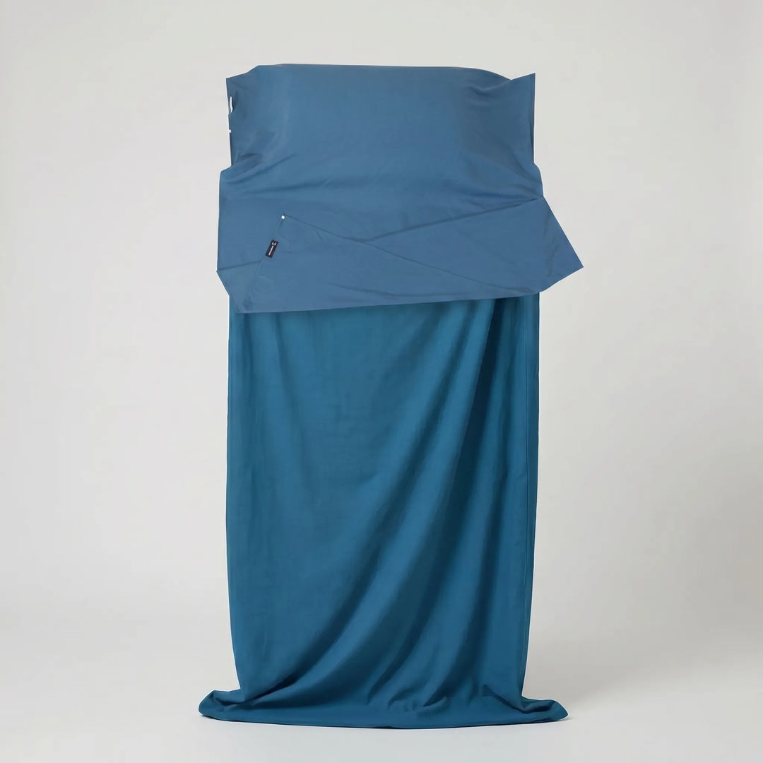 Unisex sleeping bag liner inside a sleeping bag, providing extra warmth & hygiene for camping & travel.