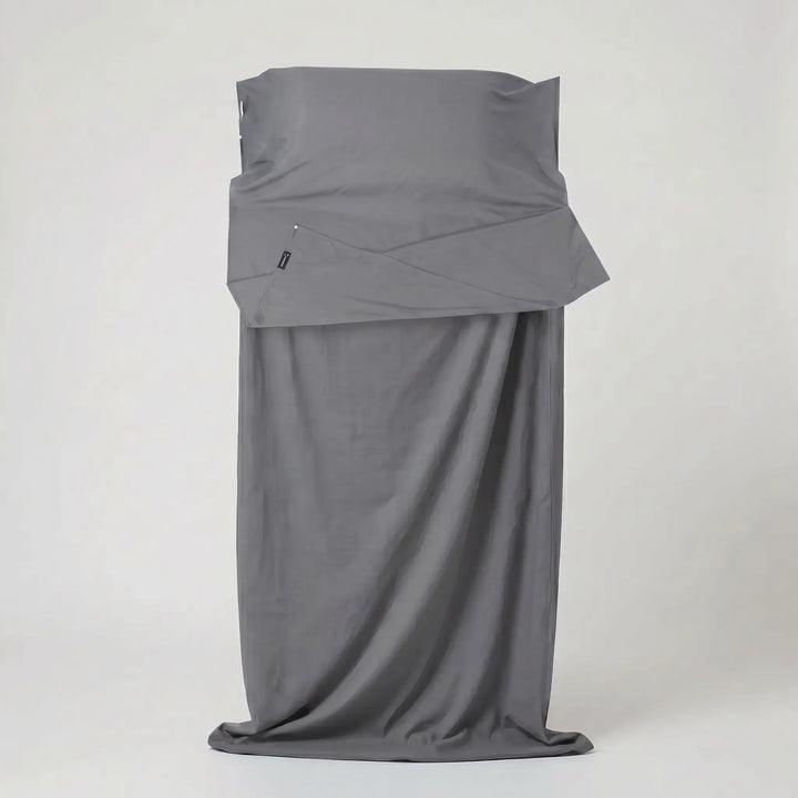 Durable unisex sleeping bag liner, a lightweight travel accessory for camping, hiking, & backpacking trips.