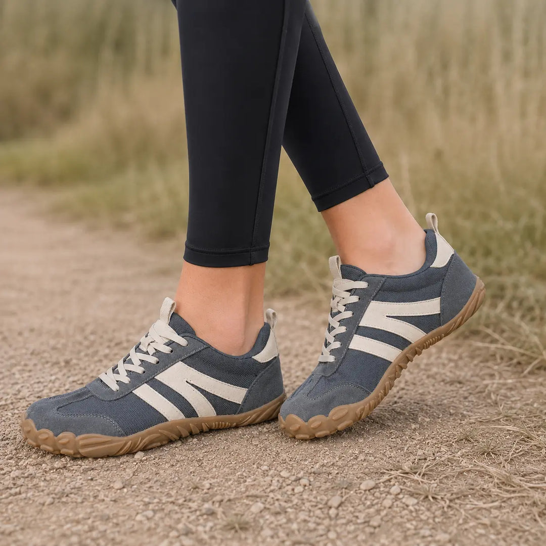 Lightweight breathable barefoot hiking shoes for women & men on outdoor trails.