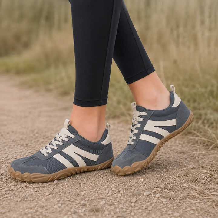 Lightweight breathable barefoot hiking shoes for women & men on outdoor trails.