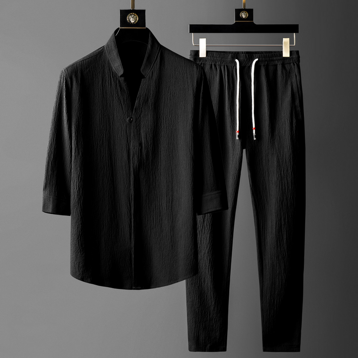 Black unisex linen blend two-piece set, offering a breathable & relaxed fit for ultimate comfort and casual style.