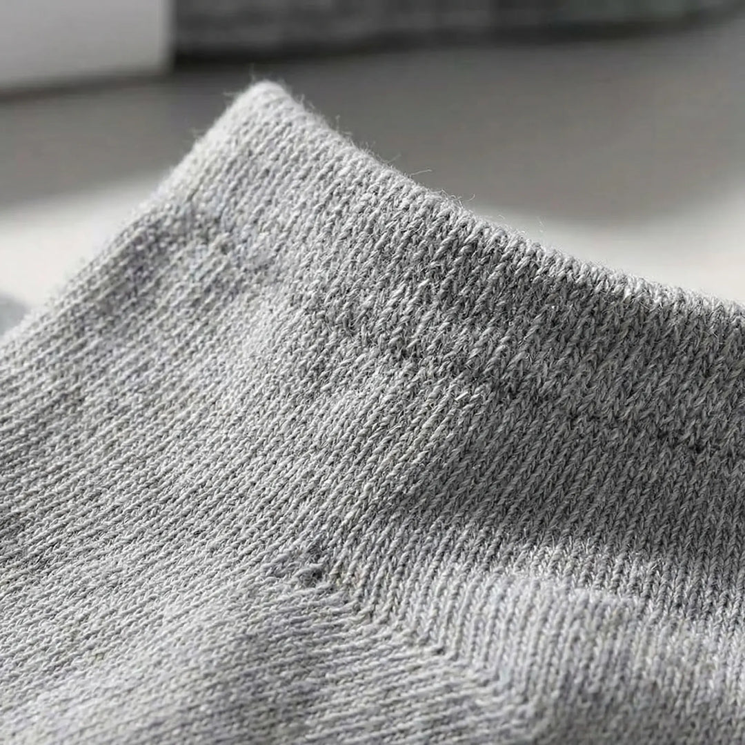 Multipack of black low-cut ankle socks, offering ultimate comfort & durability for unisex everyday wear.
