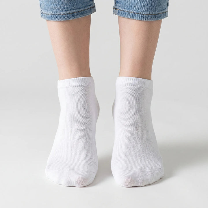 Assortment of unisex low-cut ankle socks in various colors, perfect for women's & men's everyday comfort.