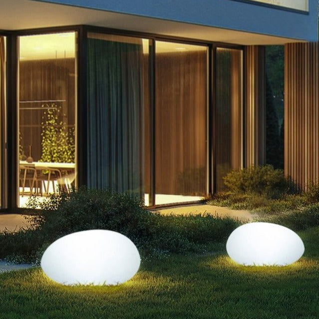 Portable LumaStone garden lamp, wireless recharging, creates cozy mood lighting for any outdoor space