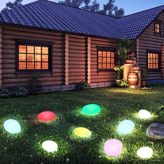 Modern LumaStone pebble lamp, wireless and solar powered, perfect for garden mood lighting