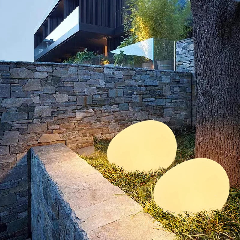 Atmospheric LumaStone pebble lamp, wireless LED, perfect for modern garden and patio decor