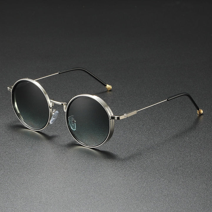 Fashionable unisex Luna circle sunglasses featuring gradient lenses and classic round metal frames.