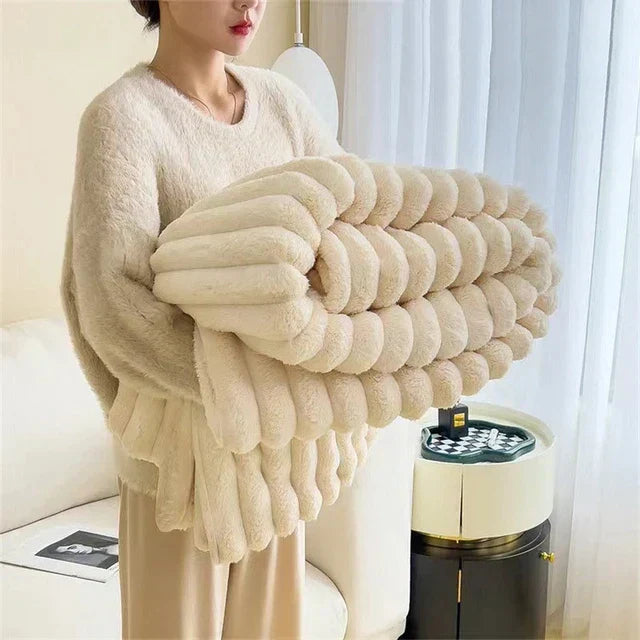 Soft, oversized plush comfort throw blanket draped over a sofa, enhancing home decor