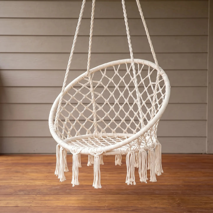 Boho macrame hanging chair swing perfect for a cozy indoor reading nook.