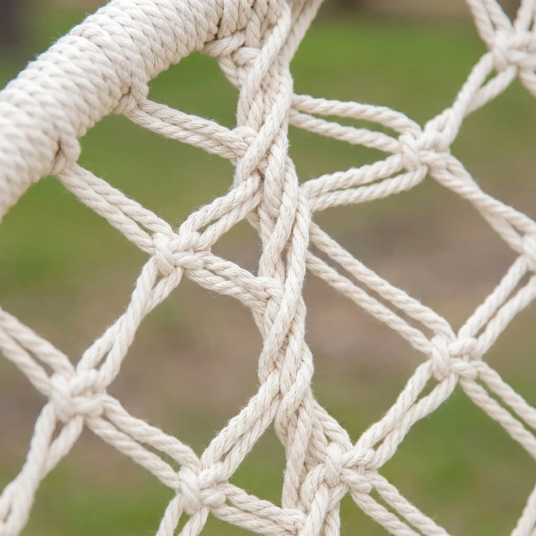 Detailed view of the woven macrame design on a unisex hanging chair swing.