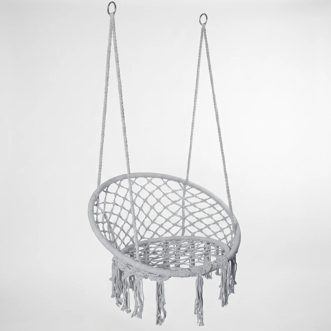 Comfortable white macrame hammock chair swing, ideal for relaxing in any setting.