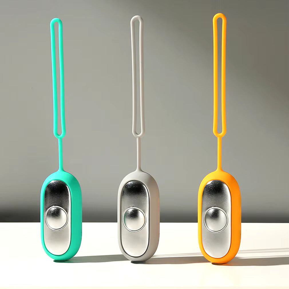 Person using a sleek, unisex microcurrent device to relieve stress and achieve deeper, restorative sleep naturally.