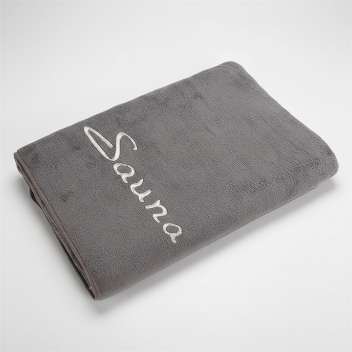 Unisex quick-dry microfiber towel in vibrant purple, ideal for beach or gym