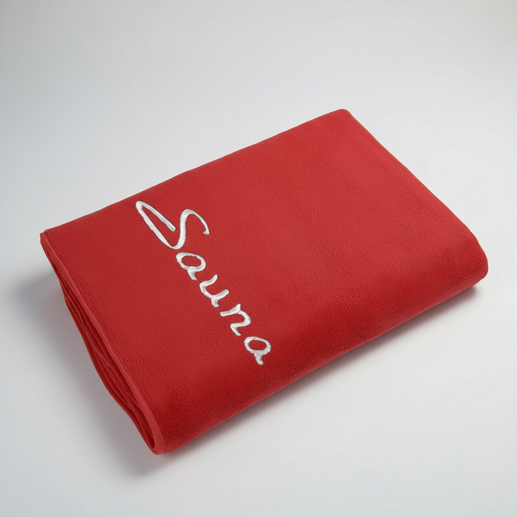 Blue quick-dry microfiber towel draped over a chair, emphasizing its lightweight nature
