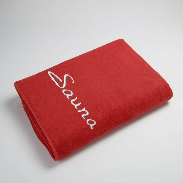 Blue quick-dry microfiber towel draped over a chair, emphasizing its lightweight nature