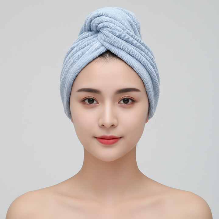 Unisex absorbent hair towel, white, against a blurred bathroom background, hair care essential