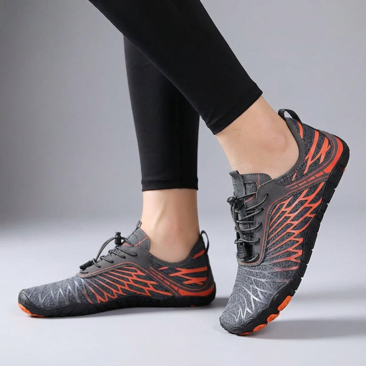 Pair of black minimalist mesh barefoot shoes, side view, showing breathable fabric and thin sole