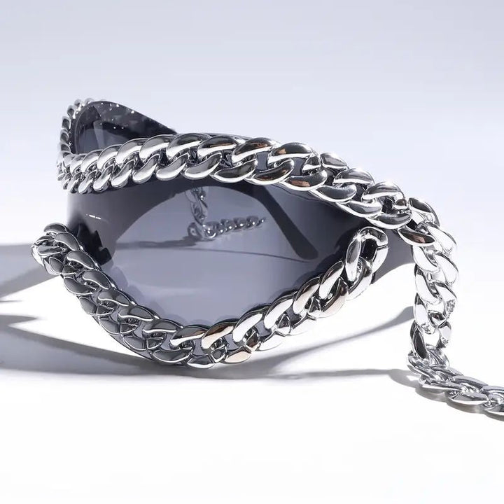 Statement unisex sunglasses: mirrored lenses & bold chain detail. Fashion eyewear for a unique, trendsetting look.
