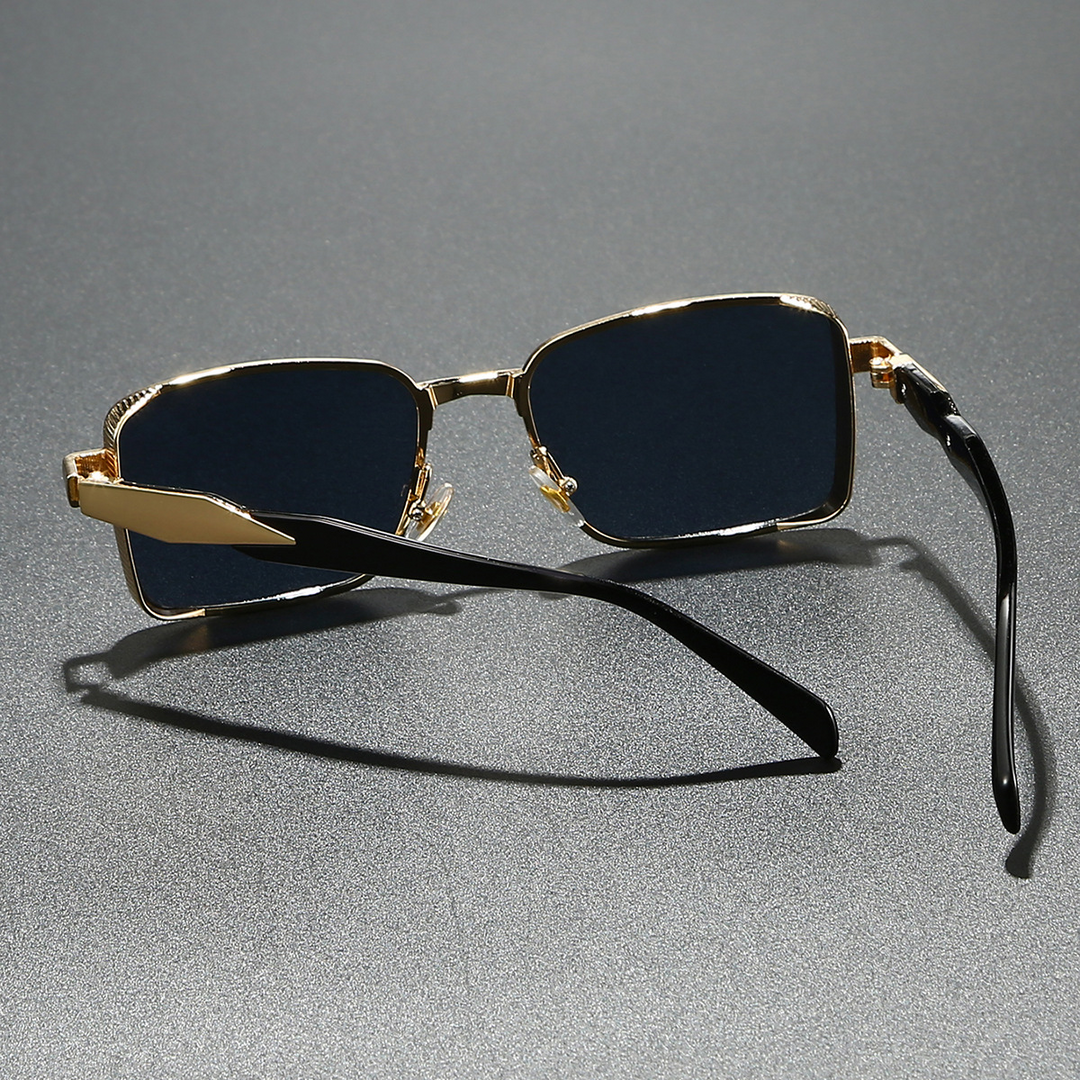 Close-up of modern square unisex sunglasses. Features sleek alloy frame & lenses providing full UV eye protection.