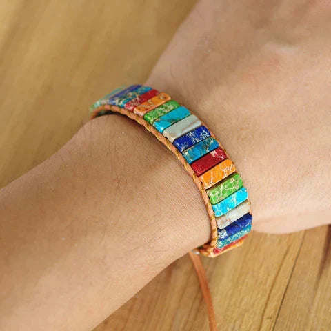 Tibetan Rainbow Jasper bracelet for spiritual journeys. Natural gemstone jewelry, unisex design for healing & style.