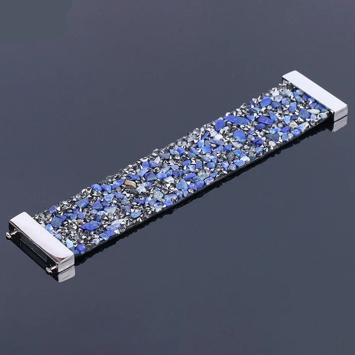 Close-up of a natural stone & crystal beaded leather bracelet. Adjustable, unisex boho jewelry.