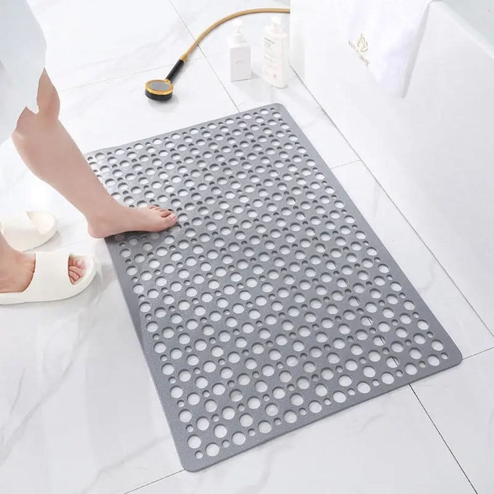 Modern non-slip bath mat, unisex, offers superior grip & comfort in wet bathroom areas.