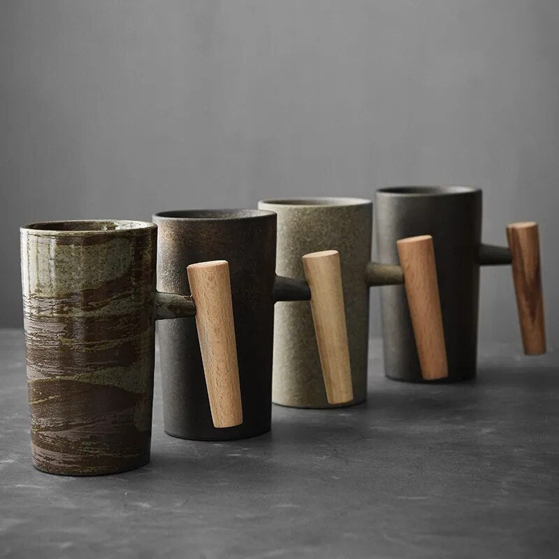 Unisex Nordic latte mug with earthy ceramic design & comfortable wood handle, perfect for coffee lovers.