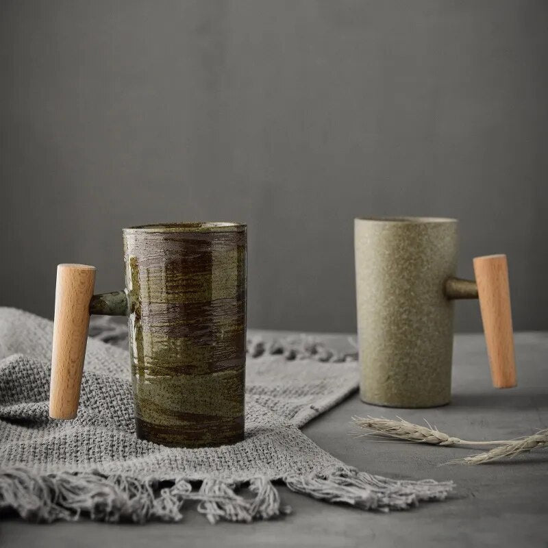 Set of two earthy Nordic latte mugs, ceramic with wood handles, bringing cozy Scandinavian style to any home.