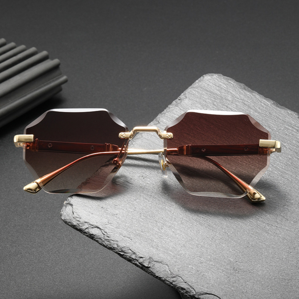 Stylish gold-tone octagonal rimless sunglasses with a modern, lightweight frame.