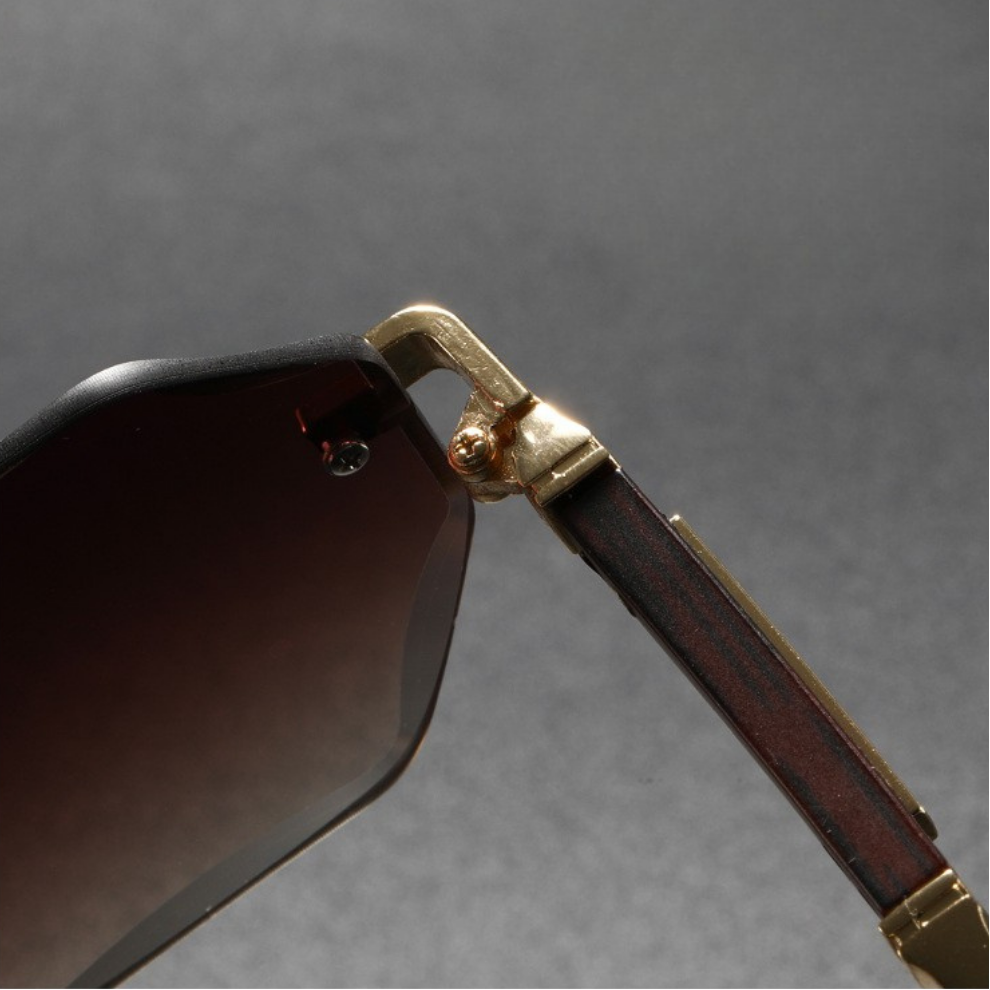 Modern gunmetal finish octagonal rimless sunglasses, a stylish accessory for men & women.