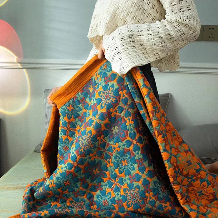 Stylish orange & blue patterned six-layer cotton quilt, a premium organic duvet for modern home decor.