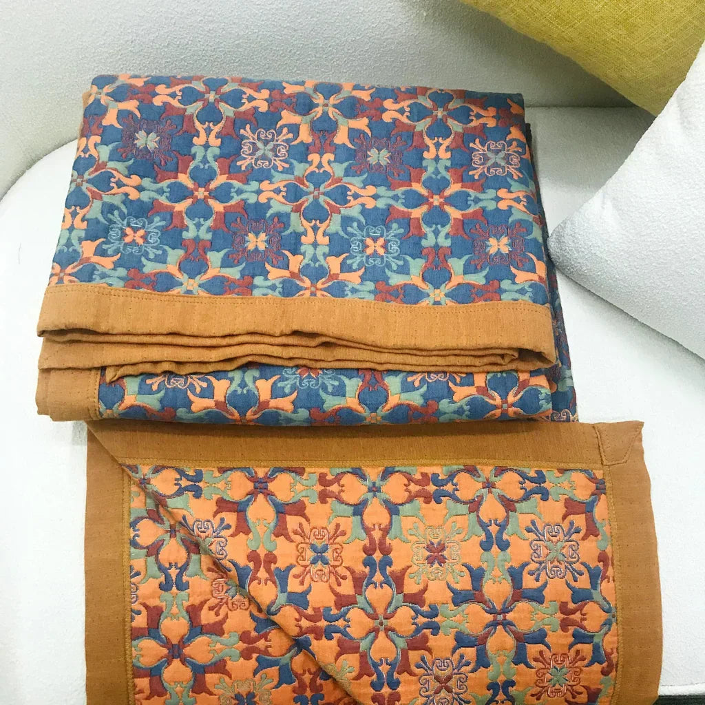 Decorative orange & blue patterned six-layer cotton quilt, a stylish organic home textile and bedding.