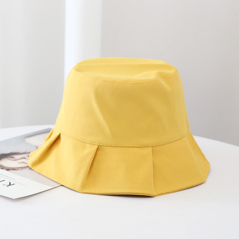 Unisex Orion bucket hat in beige, perfect for summer sun protection and beach wear.