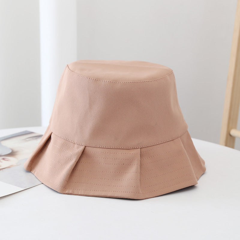 Orion bucket hat in white, offering excellent sun protection for summer and travel