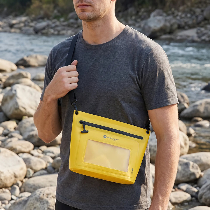 Durable waterproof crossbody bag featuring a responsive touchscreen phone window for outdoor enthusiasts.
