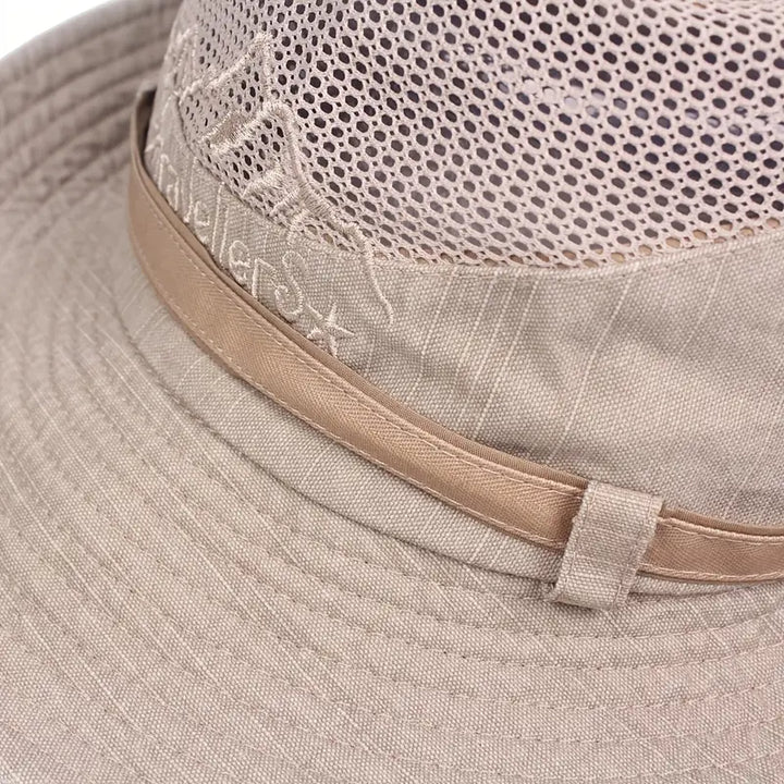 Unisex outdoor sun hat with breathable fabric, wide brim, and adjustable strap for comfortable all-day wear.