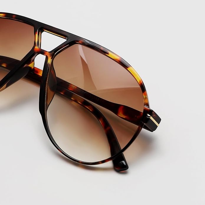 Unisex oversized retro aviator sunglasses with black frames and dark lenses, offering UV400 protection.