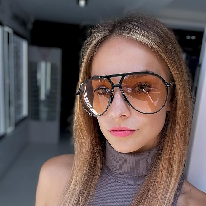 Retro aviator sunglasses with golden metal frames and dark gradient lenses, perfect unisex eyewear.