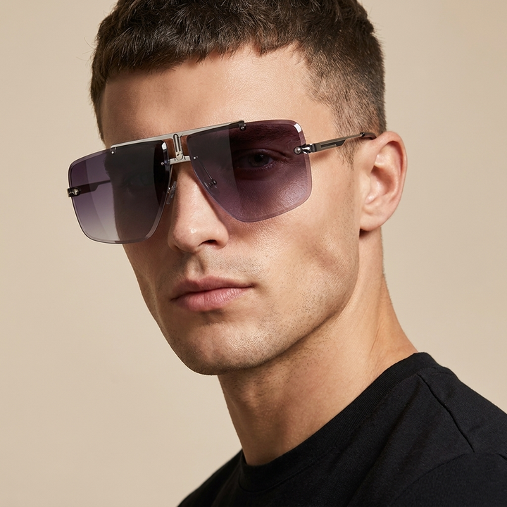 Fashionable rimless oversized sunglasses, a trendy unisex statement piece for sun protection.