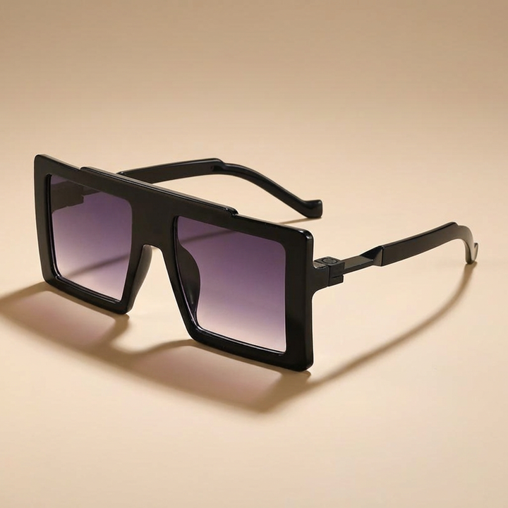 Sleek black oversized square frame sunglasses. Unisex fashion eyewear, featuring UV400 lenses for eye protection.