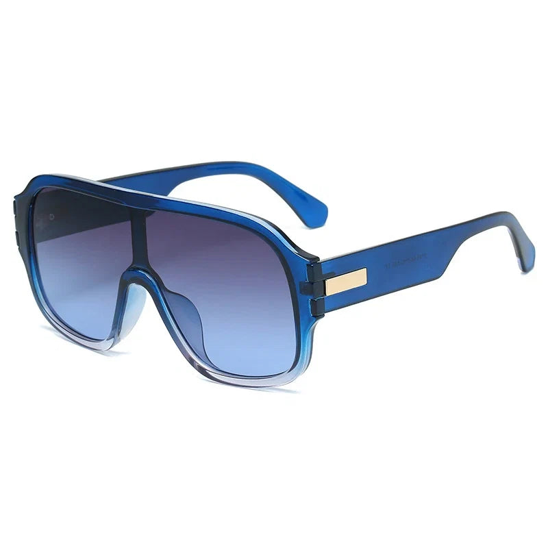 Versatile unisex oversized sunglasses with gradient lenses; a trendy accessory for stylish eye protection.