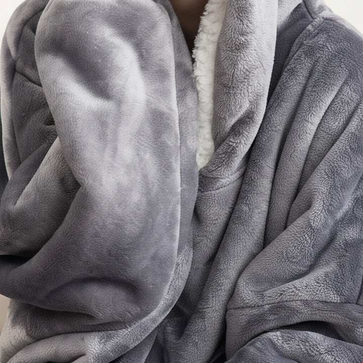 Side view of oversized fleece hoodie blanket, showcasing its generous fit and warmth