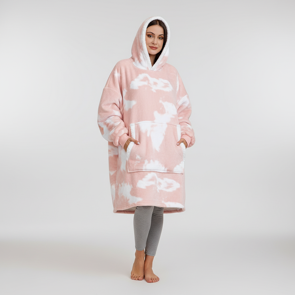 Person relaxing on a couch, wearing a comfy oversized wearable blanket hoodie