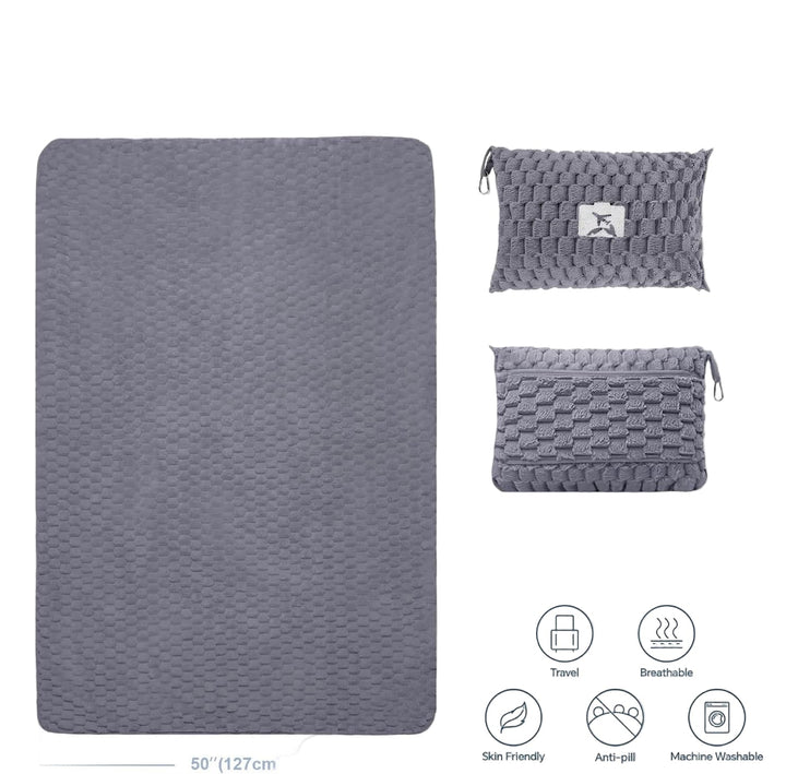 Grey flannel travel blanket with pillow, showcasing its portability and versatile design
