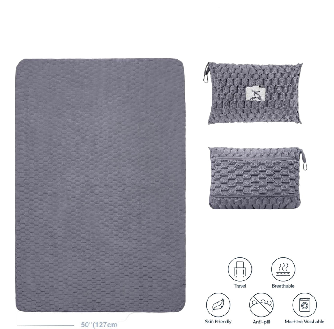 Man relaxing with packable flannel travel blanket and pillow during a car trip