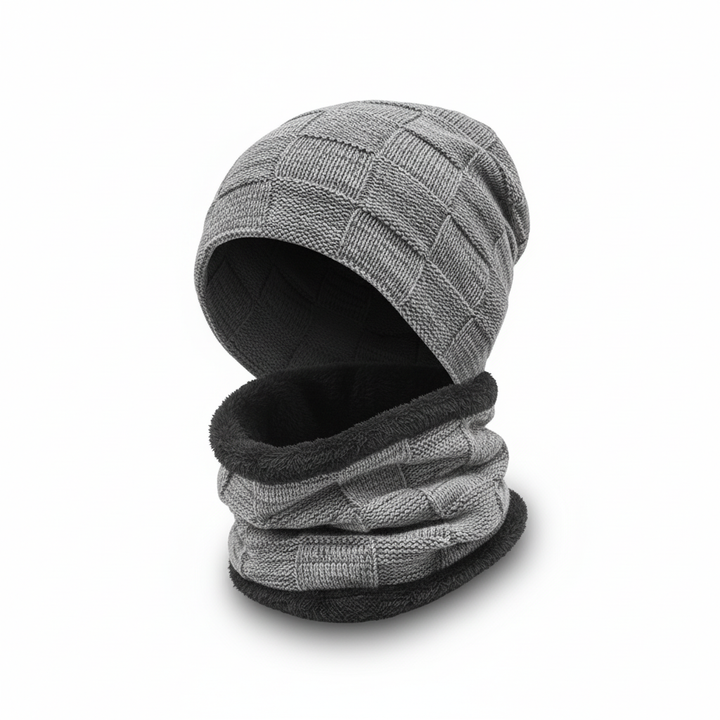 Model wearing a Pascal knit hat and matching scarf, showcasing unisex winter accessories.