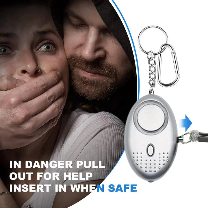 Compact personal security device: a 130 dB emergency alarm with an integrated LED flashlight for safety.