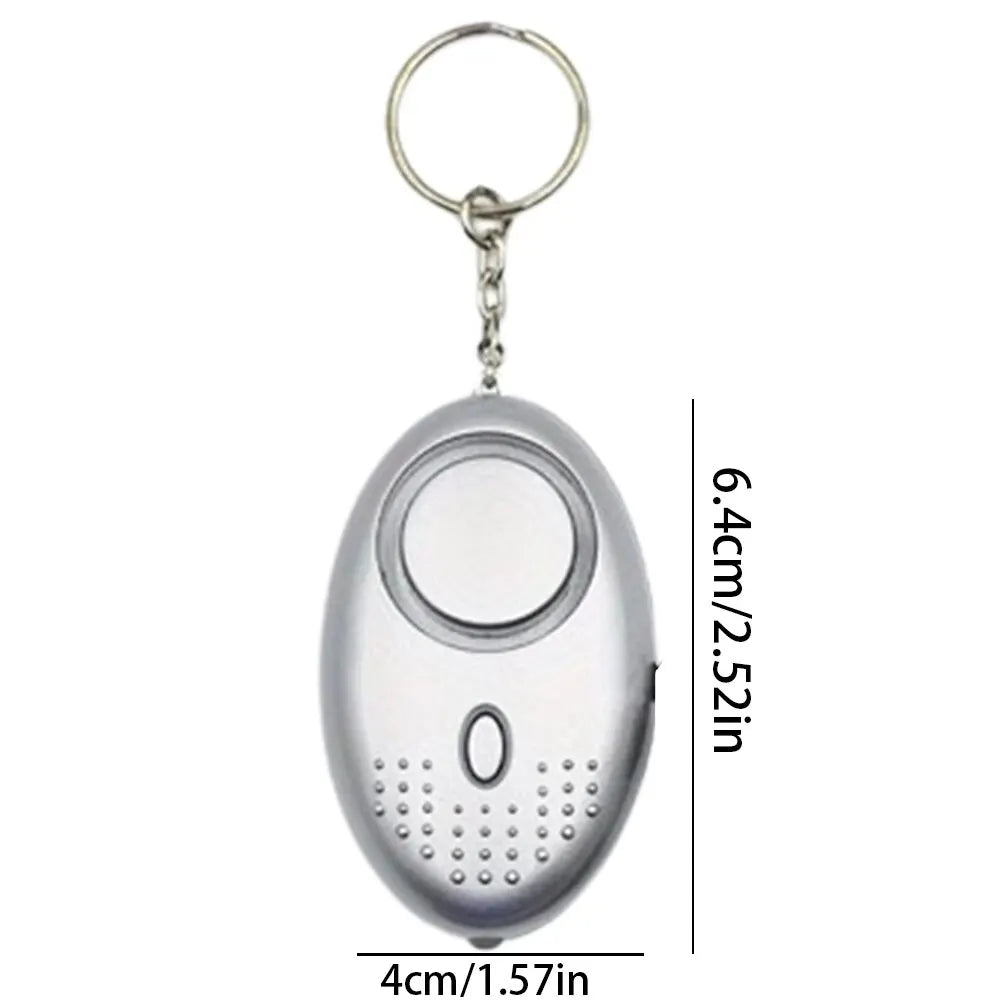 Close-up of the black personal safety alarm with LED light, a crucial self-defense tool with 130 dB volume.