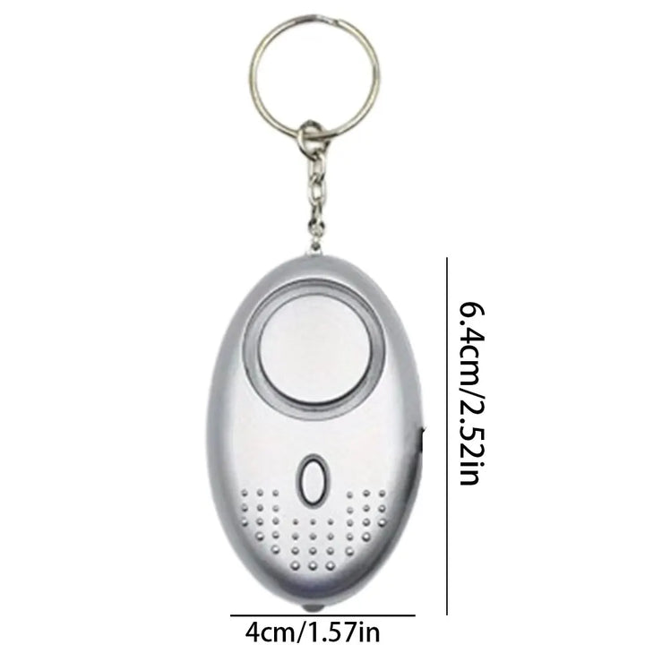 Close-up of the black personal safety alarm with LED light, a crucial self-defense tool with 130 dB volume.